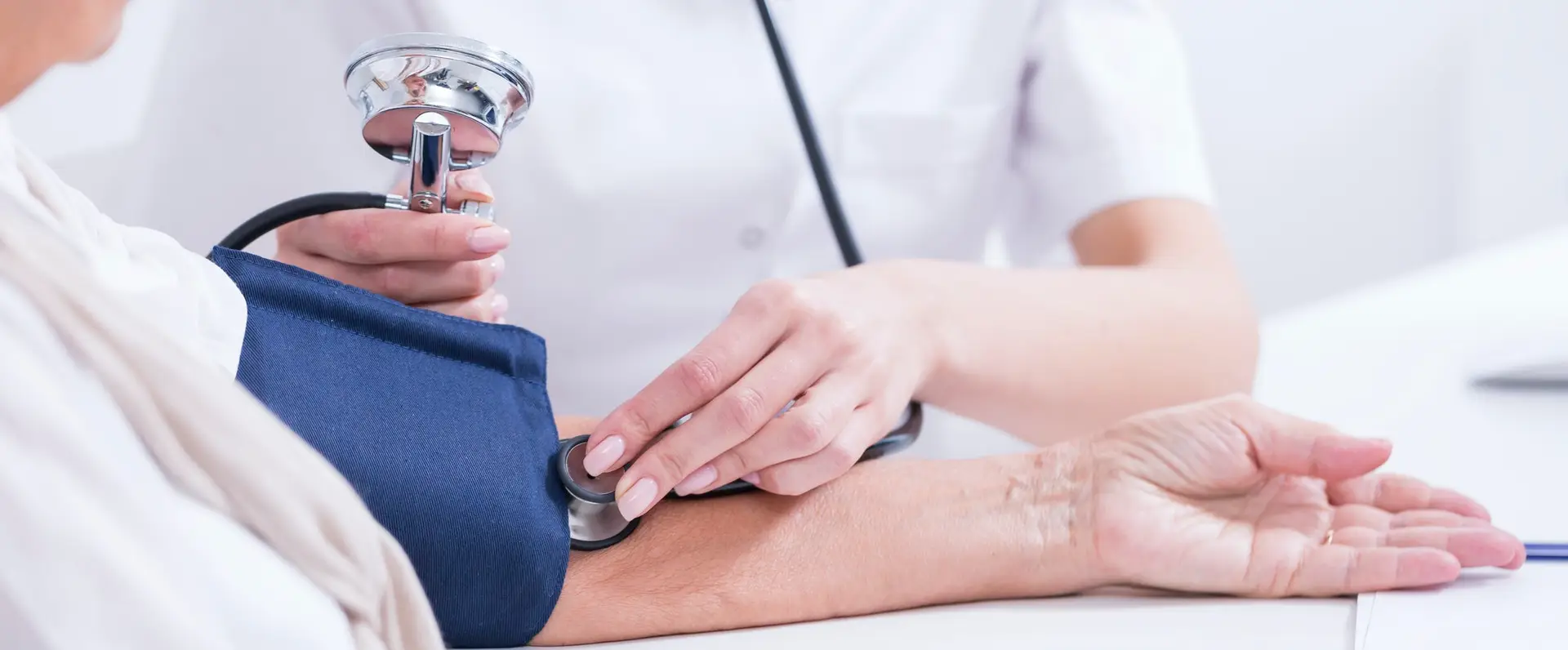 Doctor measuring patient's blood presure